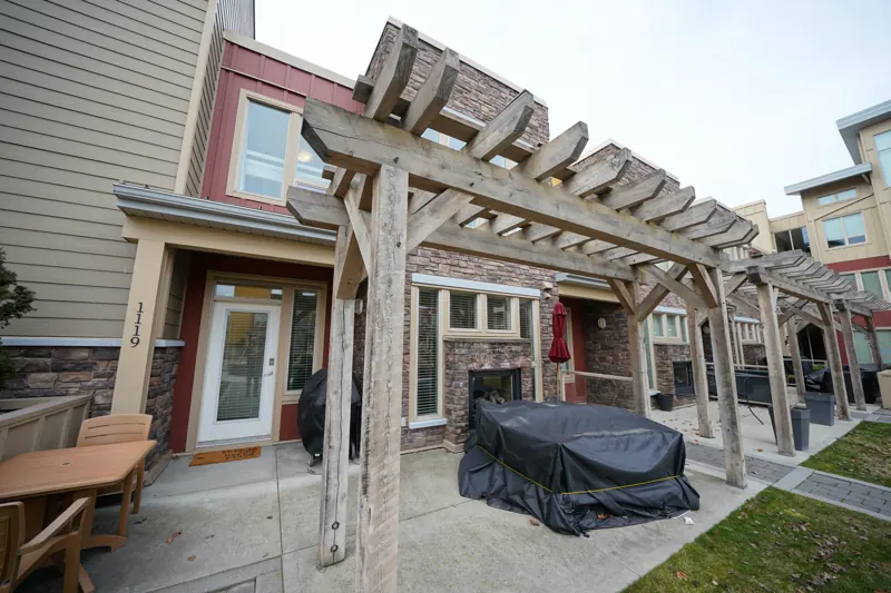 Ground-floor patio with pergola at a Strand townhome