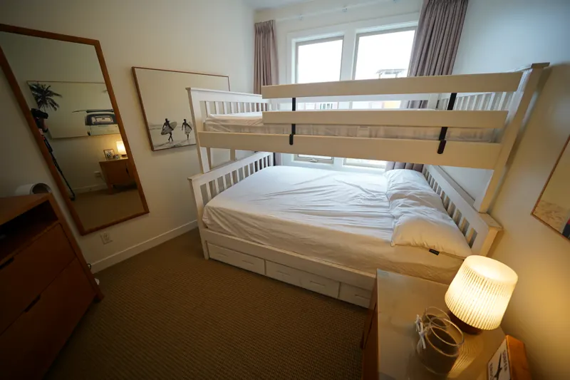 Second bedroom with bunk beds in a Strand condo