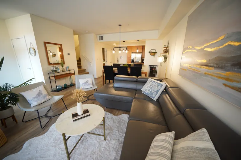 Open living and dining room with leather sectional