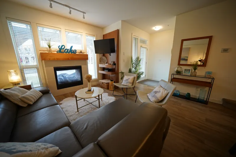 Living room with gas fireplace in a Strand home